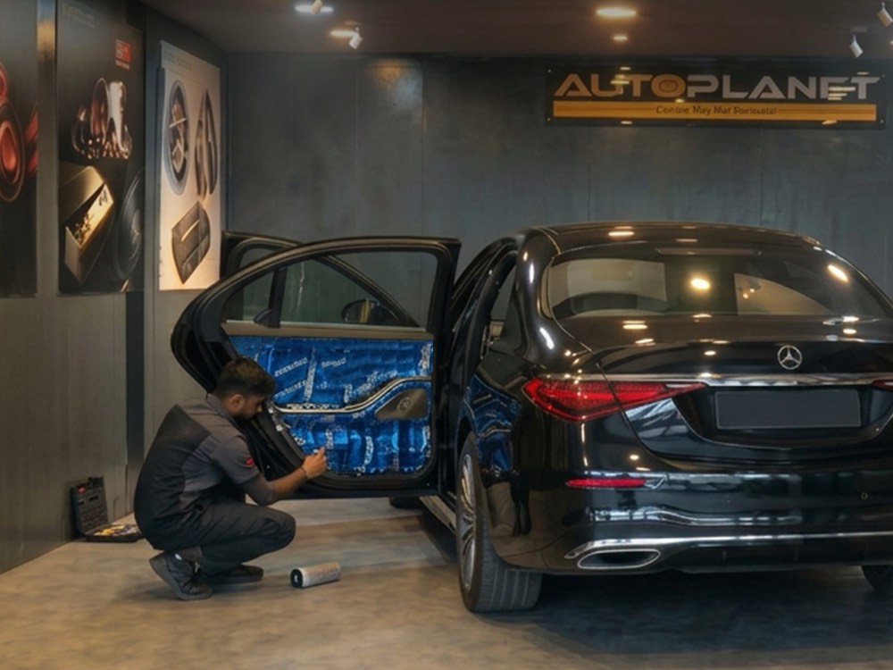 Mercedes-Benz door card removed, showing speaker mounting and sound-deadening treatment on the door skin